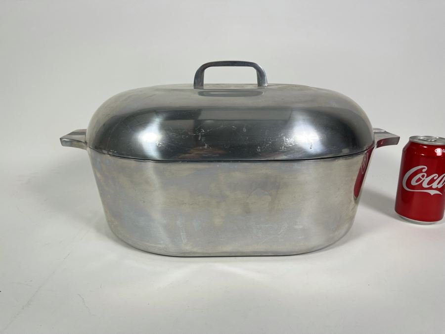 Magnalite cast aluminum cookware Dutch oven pot with lid on stovetop showing superior heat distribution and even cooking for authentic Cajun gumbo and Louisiana recipes