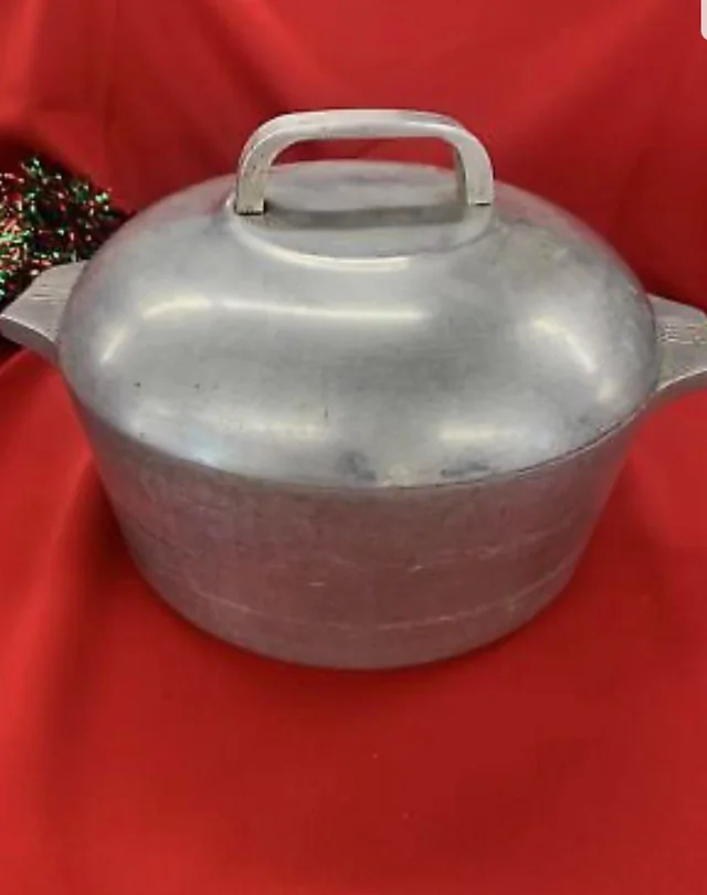 Magnalite cast aluminum gumbo pot for Cajun cooking with vapor-tight lid seal for moisture retention perfect for traditional Louisiana white beans sausage